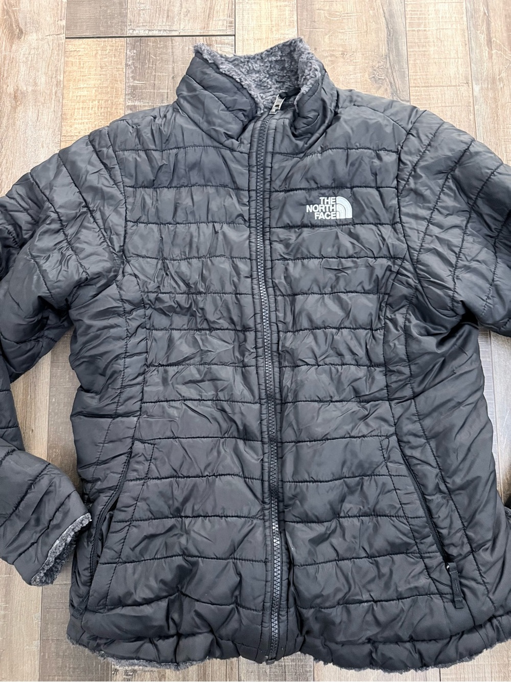 The North Face Kids Black Quilted Puffer Jacket with Fleece Lining reversible